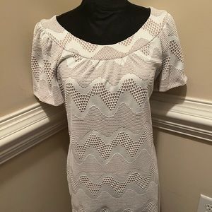 This beautiful dressed is layered with a nude layer beneath